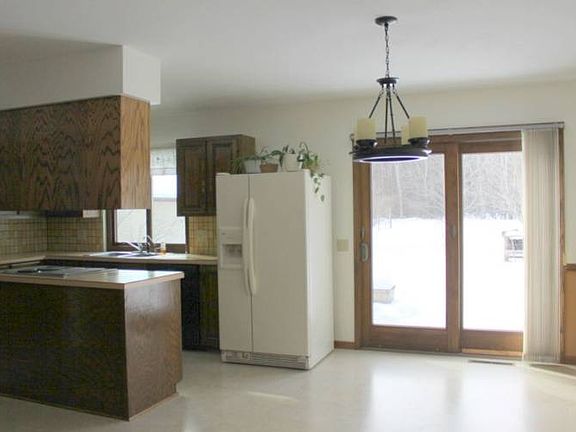 No worries! Easy care laminate flooring makes kitchen clean up a breeze.