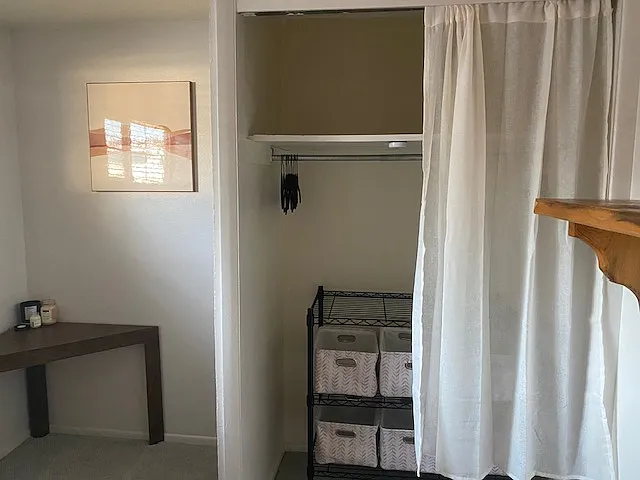 Bedroom closet with additional shelving