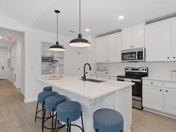Spacious island with quartz countertop