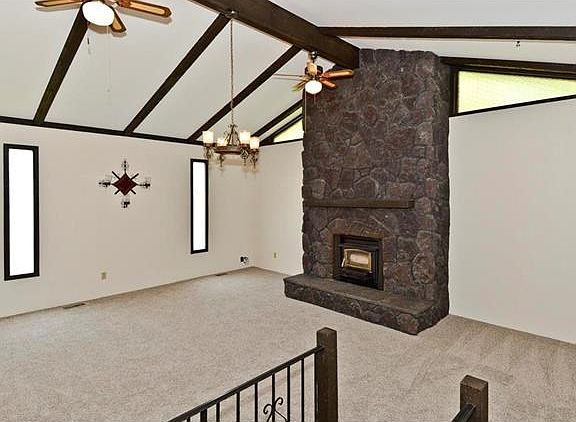 Huge great room addition with Buck Stove and brand new carpet.