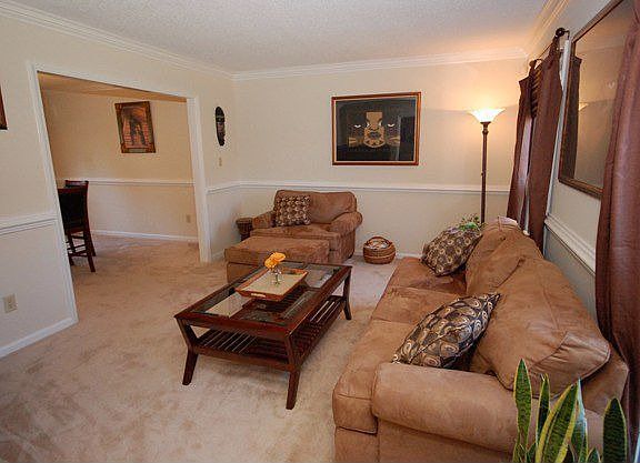 Formal Living Room filled with natural light & beautiful moldings!