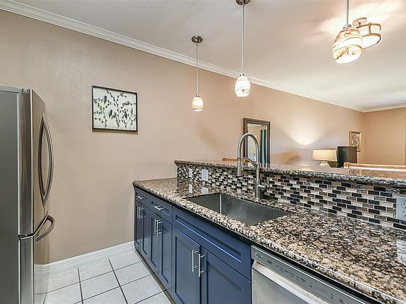 Recently renovated kitchen with new granite counter tops and custom backsplash.