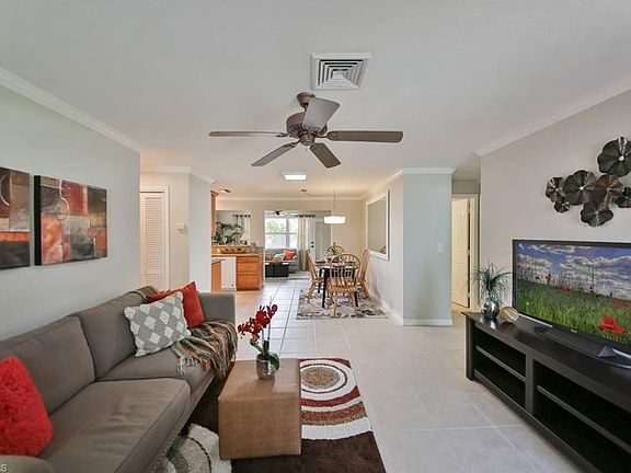 This is a shot of the Living room as seen from the front door. The dining room is shown in the background. Master bedroom suite is to the left, while the Guest bedrooms and guest bathroom are to the right.
