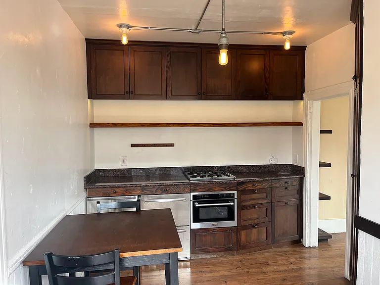 Custom Cabinetry, Industrial Lights in Kitchen, Live Edge Wood Bar in Kitchen
