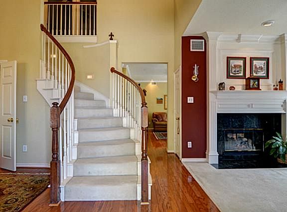 Soaring 2-Story Foyer has Dramatic Winding Staircase & Elegant Hardwood Floors!