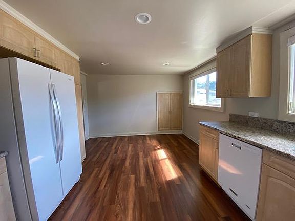 Large refrigerator and room for dining table and chairs