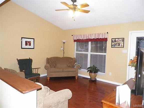 Nice size living room with vaulted ceilings and Maple hardwood flooring.