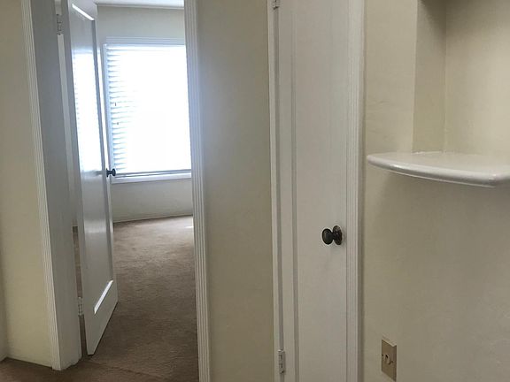 Entry to Bedroom with large windows overlooking garden