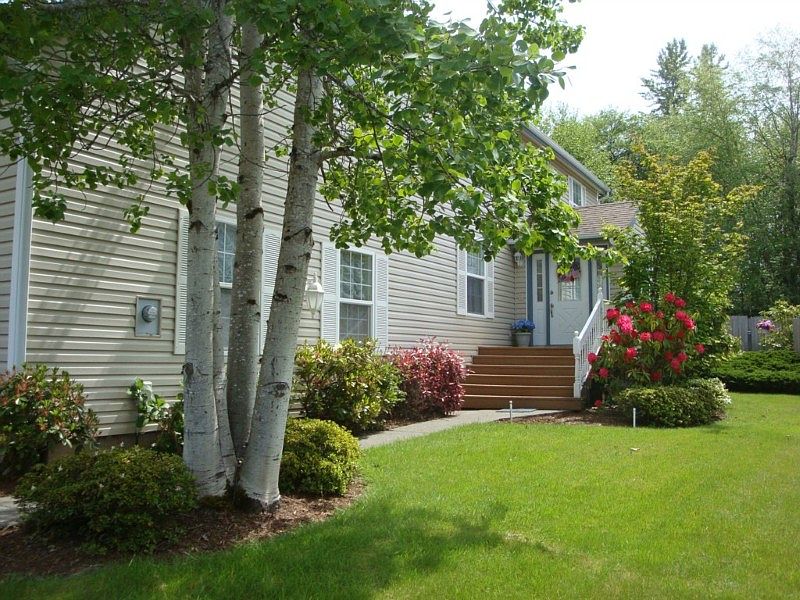 Gorgeious landscaping guides you to the inviting front door at this culdesac house, tucked back for maximum privacy from the road on Samish Hill