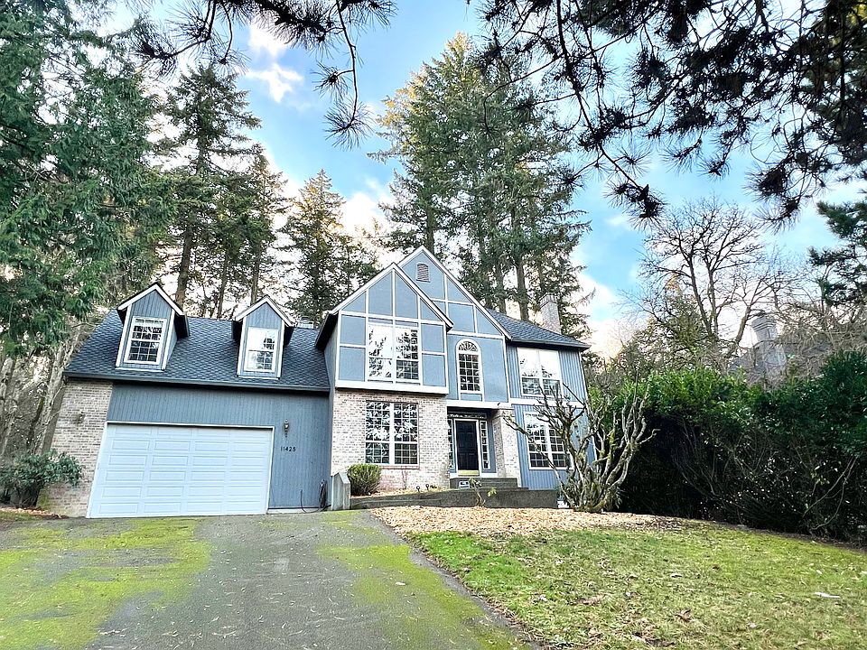 Long driveway sets the property back from the cul de sac.