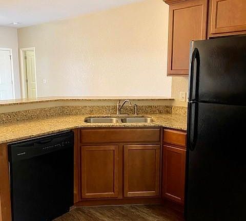 Granite countertops, deep stainless-steel sink, kitchen aid appliances.