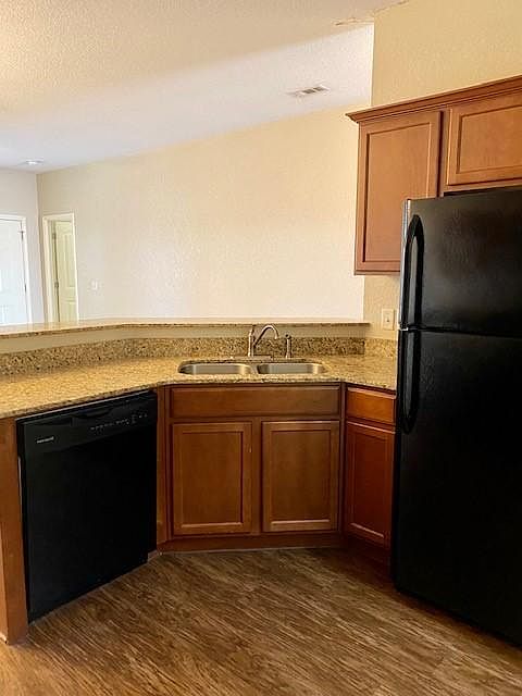 Granite countertops, deep stainless-steel sink, kitchen aid appliances.