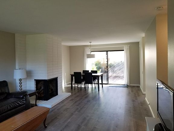 View from living room looking into backyard and dining room.