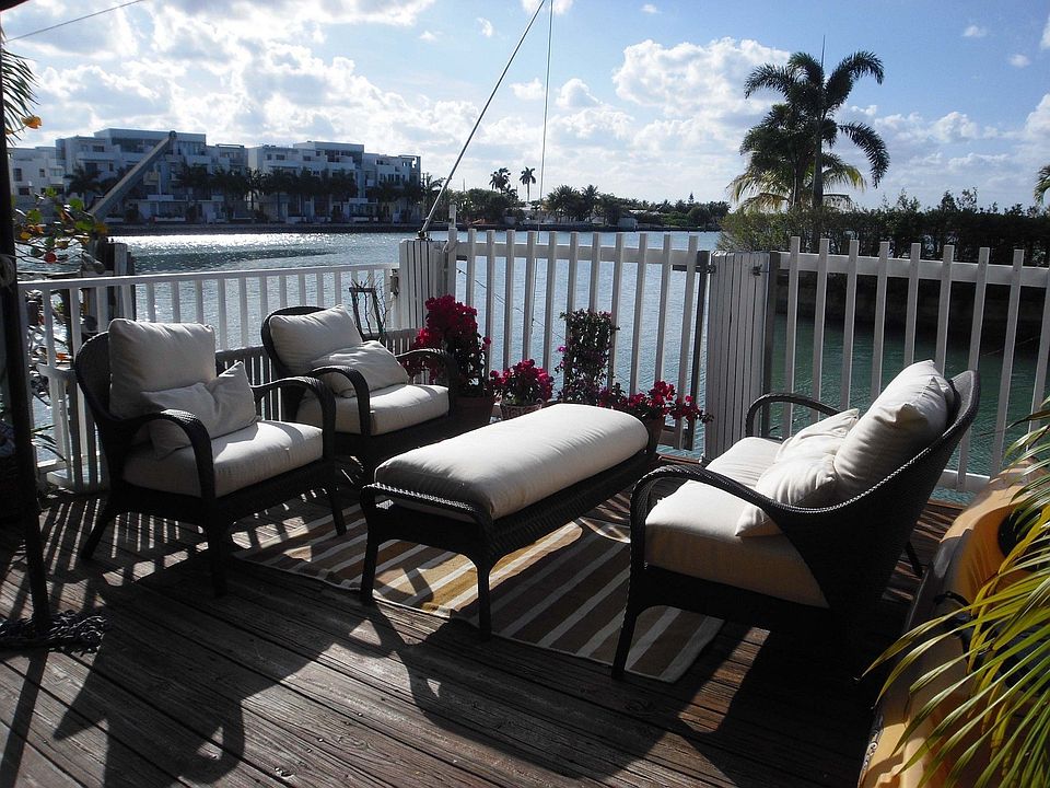 Outdoor deck overlooking water and boat dock