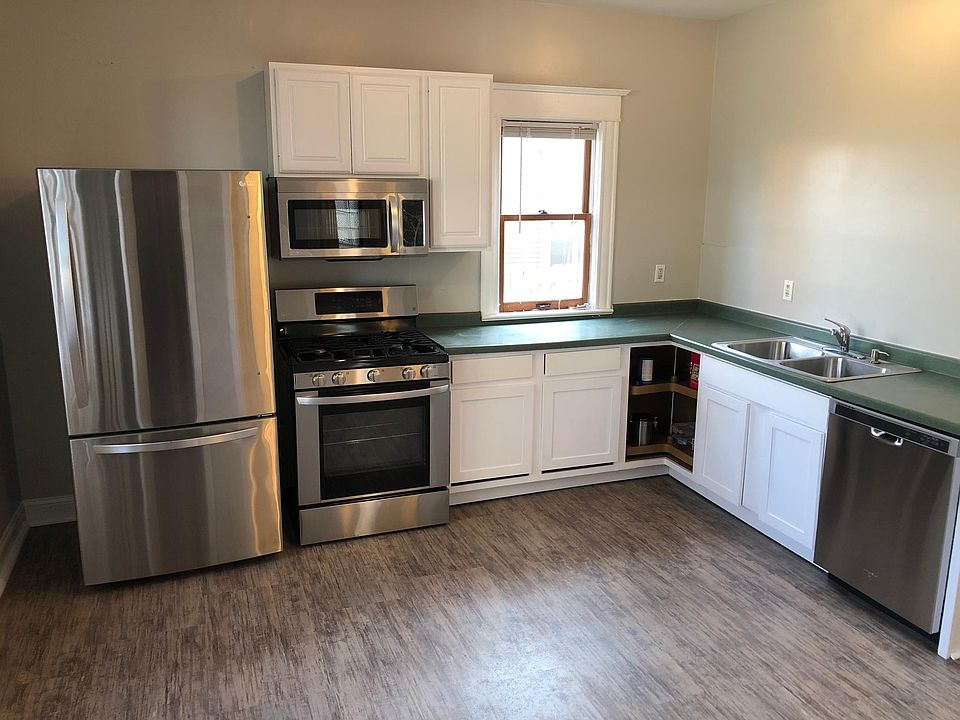 All NEW stainless appliances in HUGE kitchen - could be eat-in, or spread out and make it a cook's dream. Dishwasher and microwave included. New flooring too.