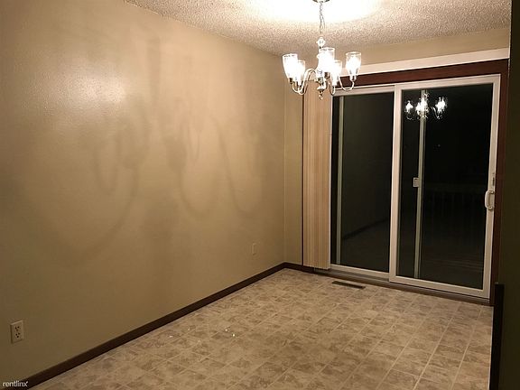 Dining room off kitchen with deck going to backyard.