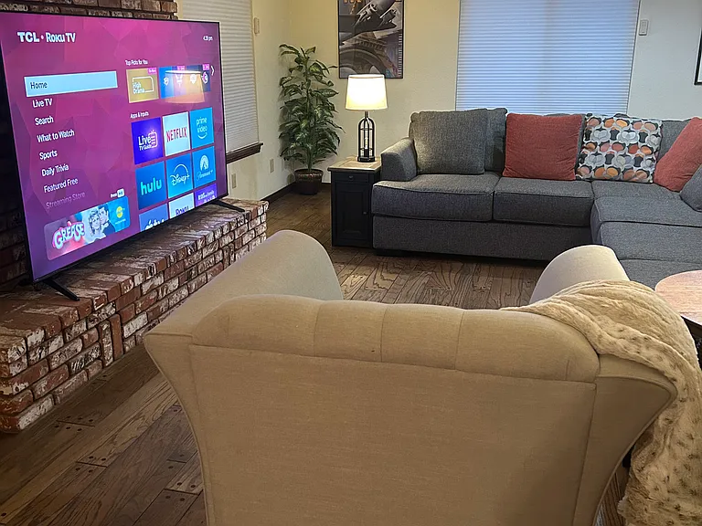 90" TV, large coffee table the has a convenient lift for meals or whatever!