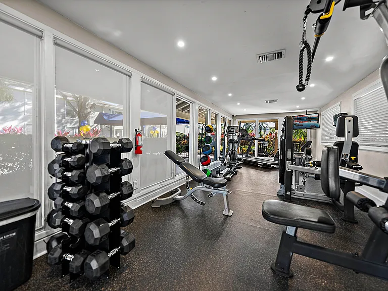 Community fitness center with free weights and strength training equipment