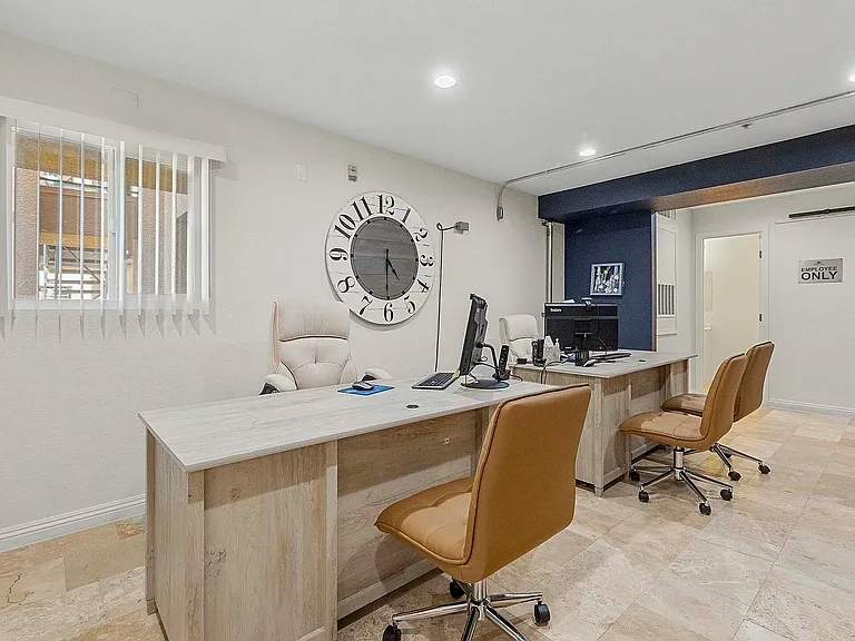 Step into this contemporary office space designed for productivity and style.