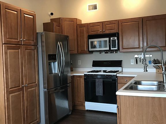 Kitchen with updated stainless steel refrigerator, dishwashe