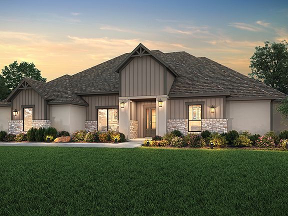The Timberline dusk rendering with stucco, dark siding and tan stone detailing.
