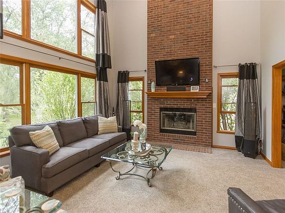 Great room, with double story windows, and full brick fireplace