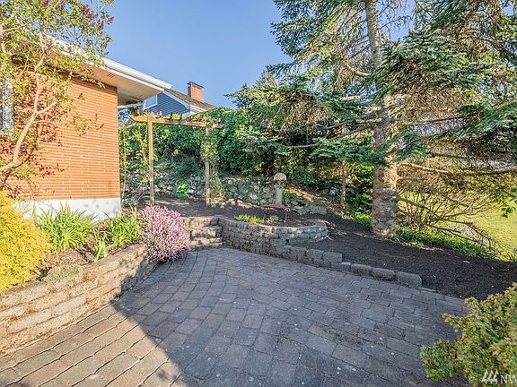 This paver front patio is the perfect spot for a patio set to enjoy the views and still maintain privacy.