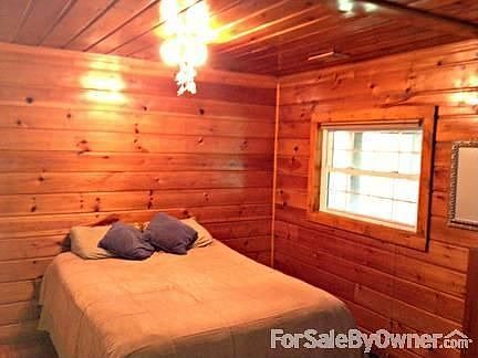 Master bedroom overlooking wooded back yard