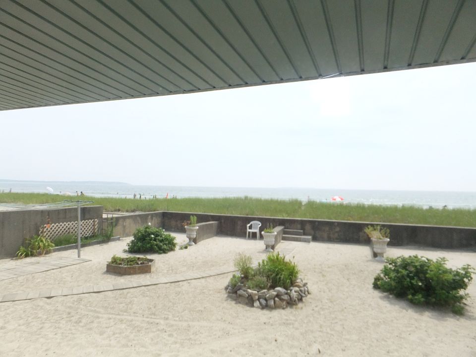 looking out window onto beach