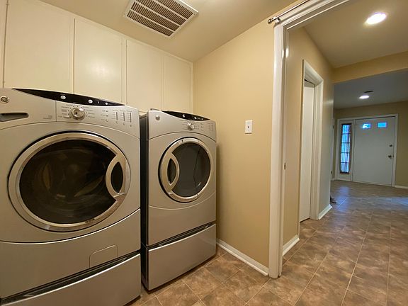 Laundry room with washer and dryer included