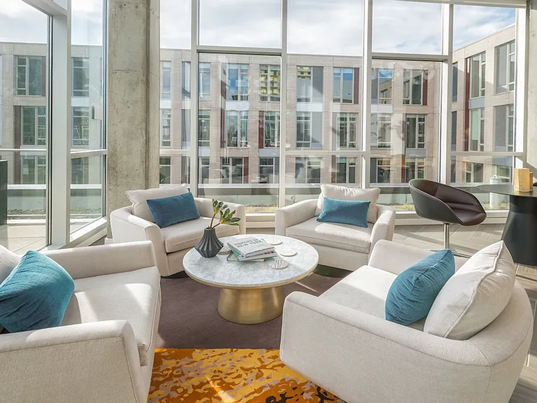 Enjoy the sun inside with floor to ceiling windows in the resident lounge
