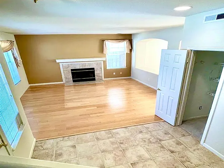 Once you step in the house, on the left is the bright living room, with a gas fireplace for warm winter days. A good size closet for your coats and bags.