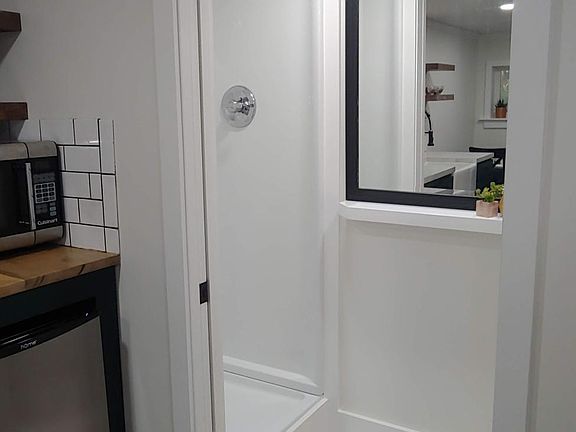 Bath and Shower behind sliding door to maximize floor space.