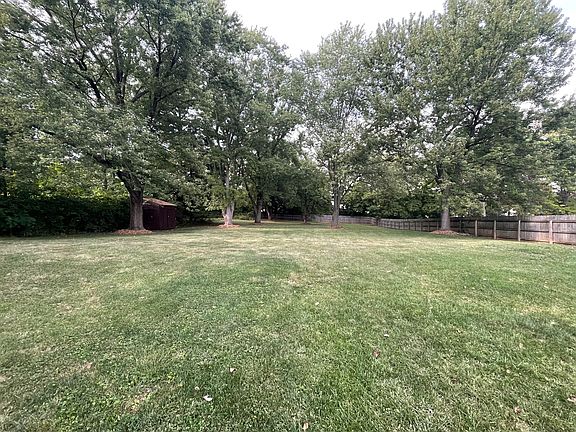 0.7 lawn with mature trees & raspberry patch.