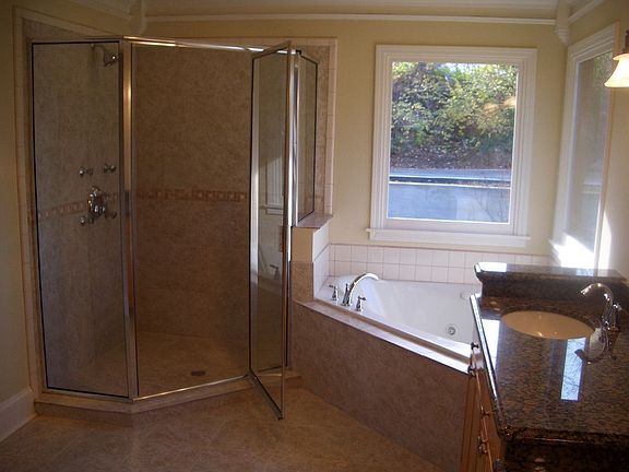 Master bath includes whirlpool tub, seperate shower with body massage sprayers