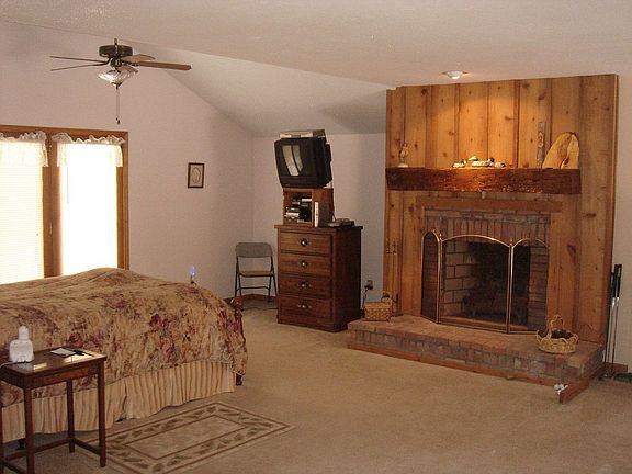 Sumptuous master includes fireplace, bath, walk-in closet, and balcony.