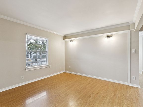 Living room with gleaming wood look flooring