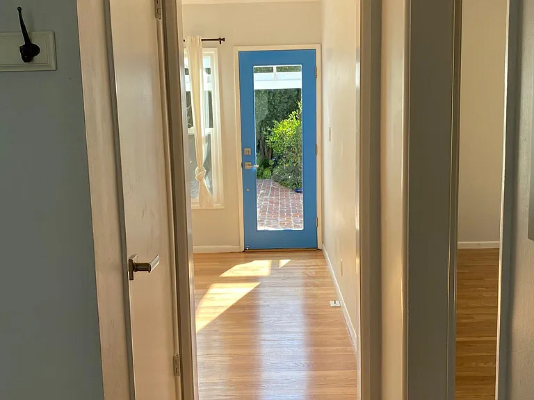View into great room and backyard from the entry hall.