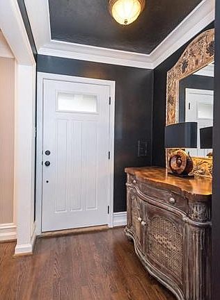 A view of the entry area from the guest closet area toward the new front door system.  Not shown in the photo is the restored chiming door bell, which is a work of art in itself.