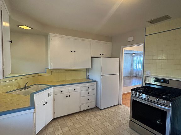 Kitchen with gas range, access to yard