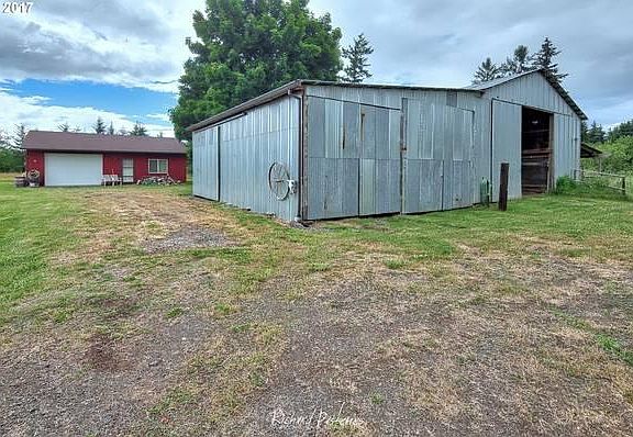 Barn & RV/trailer storage view #1 with shop/garage in background (room for multiple RVs/trailers, etc)