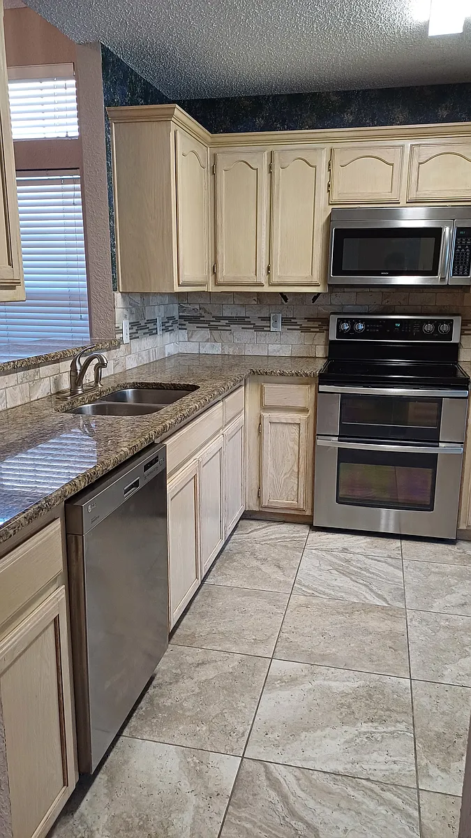 Renovated kitchen with granite counter tops and stainless steel appliances - 3051 Renaissance Ct