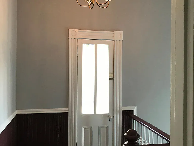 door to outside balcony in front of house