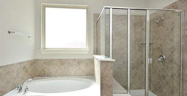 Upgraded master bath suite with separate shower and hot tub,