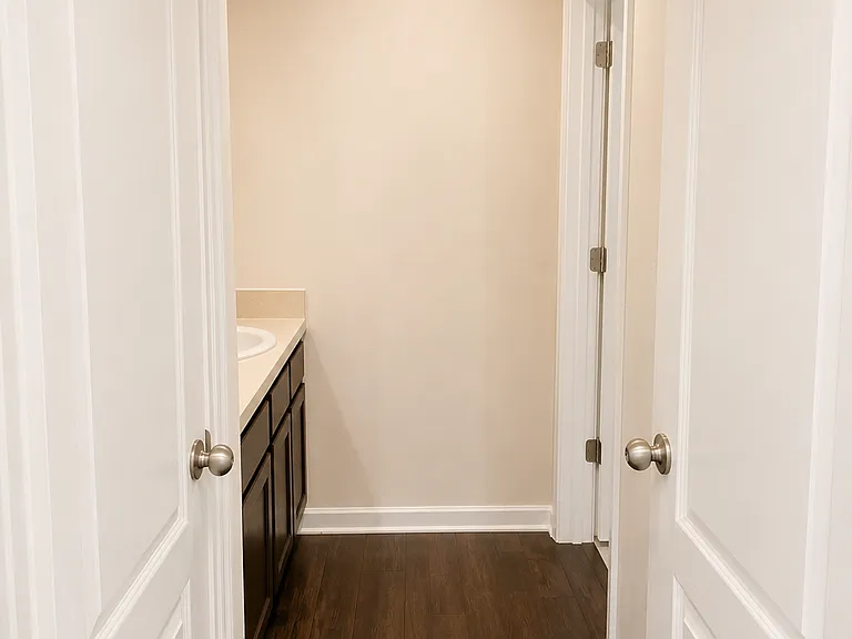 Upstairs bathroom #2 dual sinks and towel closet.
