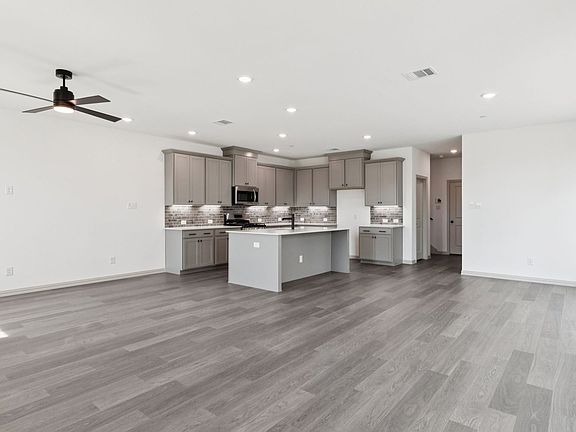 Living room in the Hansen Floorplan at Village at Midtowne in Midlothian, TX.