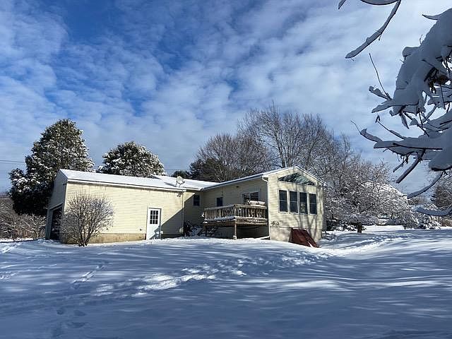 Back deck and side view of attached garage