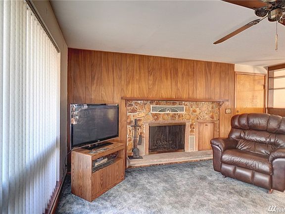 A cozy living room with a warm fireplace. 