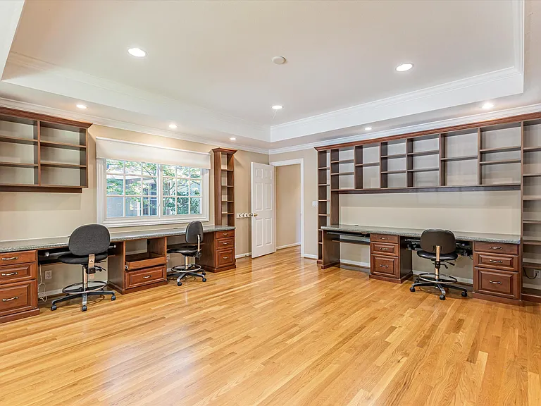 Library/Study Room with built-in shelves and desk for 4, ideal for study or work-from-home needs
