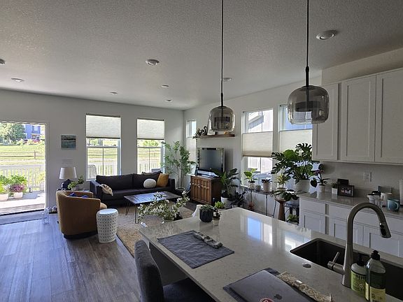 Main living and kitchen with counter seating